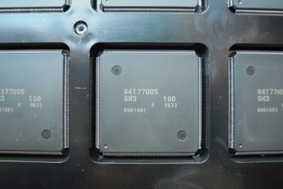 Close-up of electronic components on a metallic surface