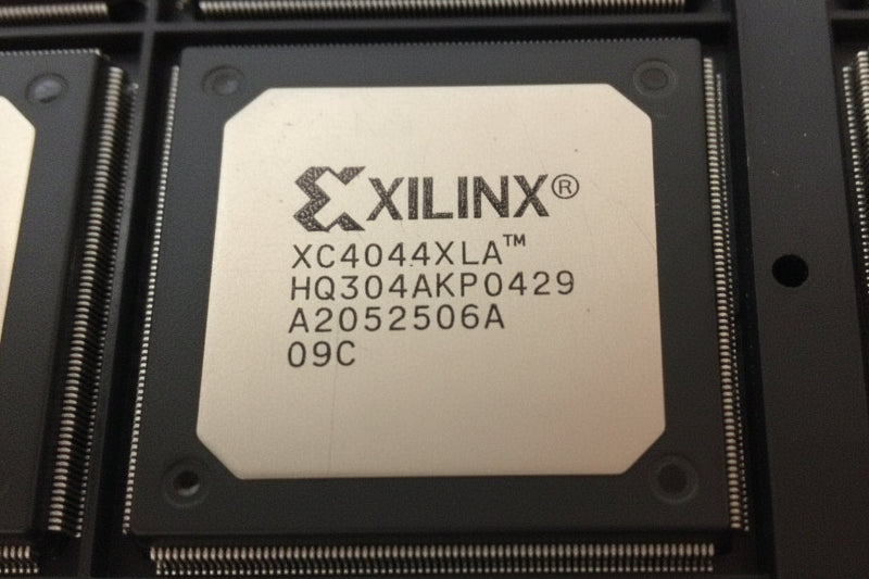 XC4044XLA-09HQ304C Xilinx FPGA chip with model number on a black background