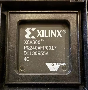 Xilinx FPGA chip with branding and model number on a black background
