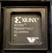 Xilinx FPGA chip with branding and model number on a black background